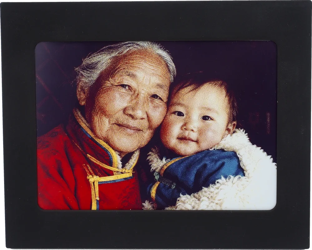 Real Peekpal prototype displaying a portrait of a woman and child